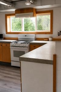 a kitchen with a stove and a counter top at Spahats Creek Resort in Clearwater
