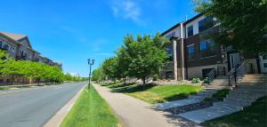 an empty street in front of a building at River Valley Stay in Eagan +4 photos
