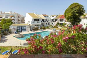 a resort with a swimming pool and some buildings at C06 - Water Tower Townhouse in Lagos