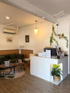 a coffee shop with a counter and a table at Bangkok Neighborhouse - Guesthouse in Bangkok +42 photos