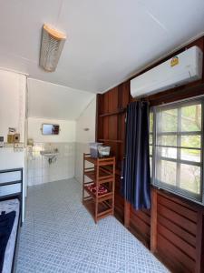 a small kitchen with a sink and a window at Blue Lotus Resort in Ban Tai