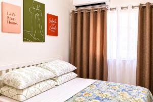 a bedroom with a bed and a window with curtains at LJ CCC CozyNest at 32 Cebu Fast Wifi Netflix You tube in Cebu City