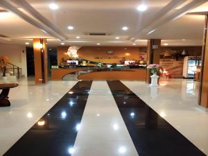 a lobby with a large white and black floor at Mukdaview Hotel in Mukdahan +48 photos