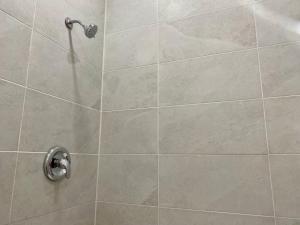 a bathroom with a shower with a glass door at South Shore Suites in Bayfield +157 photos