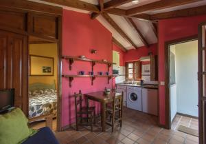 A kitchen or kitchenette at Apartamentos Rurales Playa del Canal