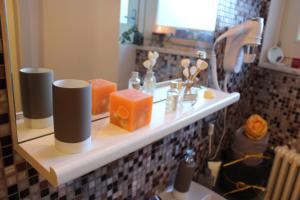 a bathroom with a shelf with soap and a mirror at Pietra Di Mare in Biassa +68 photos