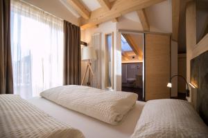 Postel nebo postele na pokoji v ubytování Hotel Al Cervo + 37 fotografií