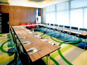 a large conference room with long tables and chairs at ibis Styles Brest Centre Port in Brest