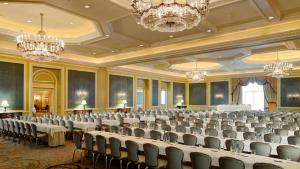 a large ballroom with chairs and tables and chandeliers at InterContinental Dublin by IHG in Dublin +109 photos