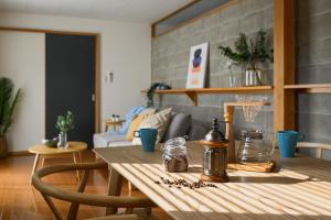a wooden table in a living room with a tableablish at Building D - Vacation STAY 84939v in Bōchū