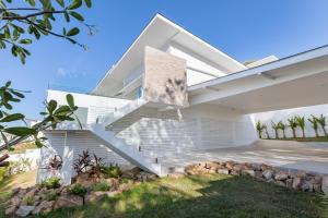 an image of a house with a staircase at Rockstarvillas Grande Siesta in Nathon Bay