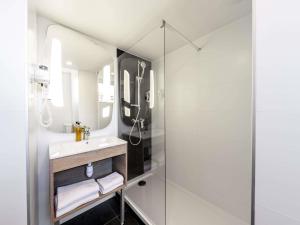 a bathroom with a sink and a shower at ibis Styles Marseille Centre Prado Place Castellane in Marseille