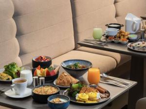 a tray of breakfast foods on a table at ibis Bangkok Siam in Bangkok +12 photos