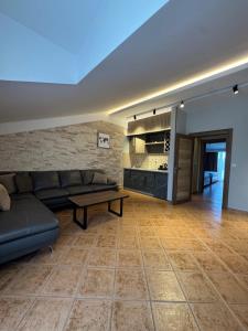 a living room with a couch and a table at Resort Comfort - Long Beach in Ulcinj