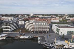 an aerial view of a city with boats in the water at THE LIBERTY Hotel Bremerhaven BW Signature Collection in Bremerhaven