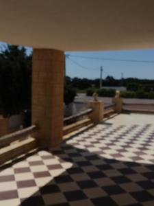 a view of a room with a checkered floor at Dari in El Haouaria +3 photos