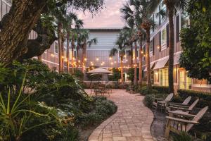 a courtyard with benches and lights in a building at Hampton Inn New Smyrna Beach in New Smyrna Beach