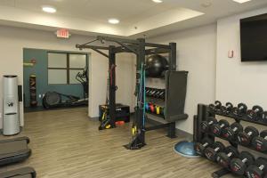 a fitness room with a gym with a rack of exercise equipment at Hampton Inn Lima in Lima