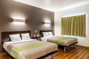 Voodi või voodid majutusasutuse Super 8 by Wyndham Kenedy toas