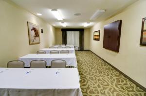 a row of tables and chairs in a room at Comfort Inn & Suites Amarillo West Near Medical Center in Amarillo +30 photos
