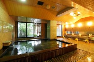 a large room with a pool of water in the middle at Royal Hotel Kawaguchiko in Fujikawaguchiko