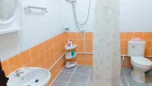 a bathroom with a toilet and a sink at Pai Town Home in Pai