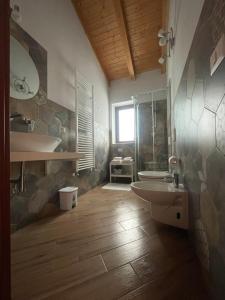 a bathroom with a toilet and a sink at CAMILLA affitta camere in Nicolosi +69 photos