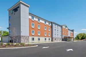 an empty street in front of a building at WoodSpring Suites Lancaster North in Lancaster