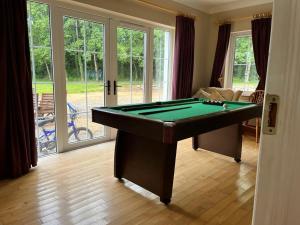 a living room with a pool table in it at White House tree view in Drumshanbo