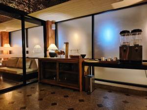 a room with a desk and a bed in a room at Wangkaew Hotel, Phitsanulok in Phitsanulok