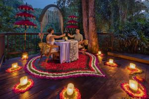 two people sitting at a table with candles and flowers at The Lokha Ubud Resort, Villas & SPA in Ubud +61 photos