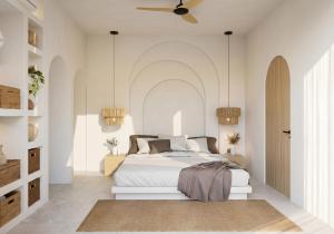 a bedroom with a bed and a ceiling fan at Svara Boutique Residences in Uluwatu