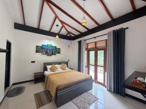 a bedroom with a bed and a large window at Maya 44 Boutique Ella in Ella