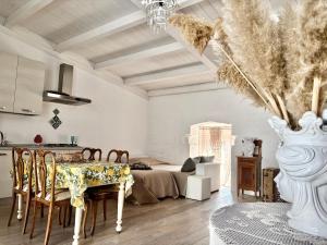 a living room with a table and a couch at B&B dell'orologio in Acquaviva delle Fonti