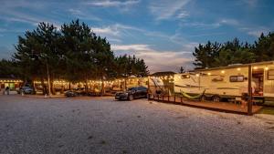 a group of rvs parked in a parking lot at Yangyang Hajodae Campingcar in Yangyang