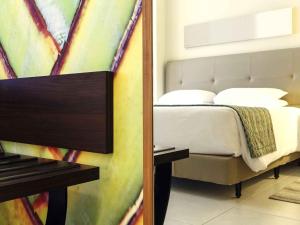 a bedroom with a bed in a room at Mercure Salvador Pituba in Salvador +72 photos