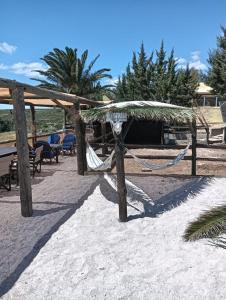 a hammock in the sand on a beach at Yellowstone in Kefalos +21 photos
