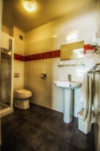 a bathroom with a sink and a toilet at Hôtel PRADO avec Parking - Proche Zénith in Toulouse +15 photos