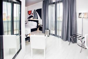 Amatì Design Green Hotel的电视和/或娱乐中心