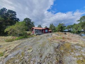 a house sitting on top of a hill at Lillstugan at Sävö in Västerljung