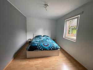 a bedroom with a bed in a room with a window at Maison avec piscine à Dinant in Sorinnes +6 photos