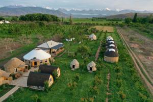 an aerial view of a group of tents in a field at Bosogo Yurt camp in Bokonbayevo
