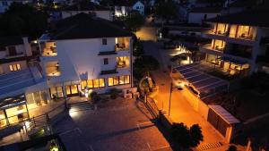 an aerial view of a building at night at Boutique Resort Villa VISTA in Malinska