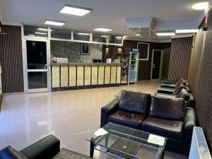 a lobby with couches and a bar in a store at Prima Hotel in Antalya