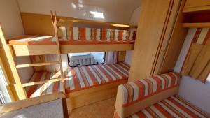 a small room with two bunk beds in it at Espacio Finca Alegría - Rural Houses & Rooms in Cartagena +37 photos