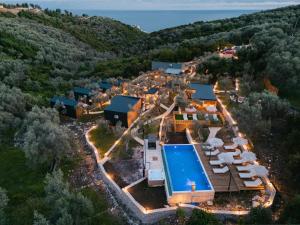 an aerial view of a mansion with a swimming pool at Azure Olive Collection in Ulcinj