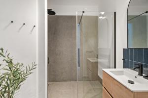 a bathroom with a shower and a sink at dreamfactory Residence - Royal Westside in Vienna +39 photos