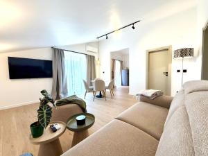 a living room with a couch and a table at Villa Tina Luxury Suite Newly Renovated 2026 in Novigrad Istria