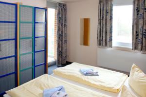 Ein Bett oder Betten in einem Zimmer der Unterkunft VCH Hotel Greifswald