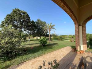 an open porch with a view of a park at Casale Country Chic- Sabaudia in Borgo Isonzo +42 photos